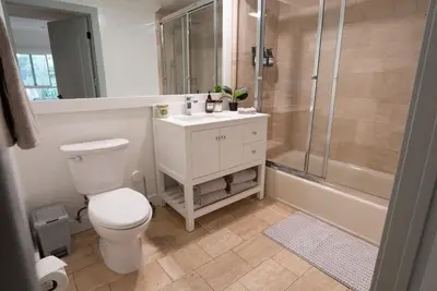 a bathroom with a toilet and a shower and a sink at Charming 2bd Condo on SunsetStrip in Los Angeles
