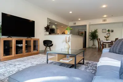 a living room with a couch and a tv at Charming 2bd Condo on SunsetStrip in Los Angeles