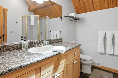 a bathroom with a sink and a toilet at Lakeview Lodge - Across the street from the lake and Boulder Bay Park! in Big Bear Lake