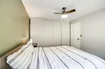 a bedroom with a bed and a ceiling fan at Pine Mountain Club Cabin with AandC and EV Charger in Pine Mountain Club