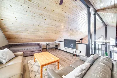a living room with a couch and a table at Pine Mountain Club Cabin with AandC and EV Charger in Pine Mountain Club