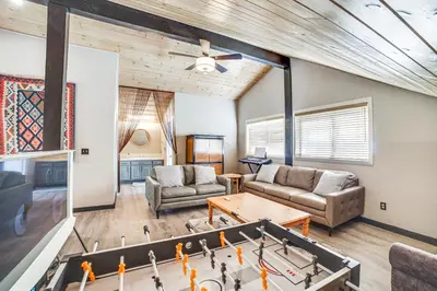 a living room with a ping pong table at Pine Mountain Club Cabin with AandC and EV Charger in Pine Mountain Club