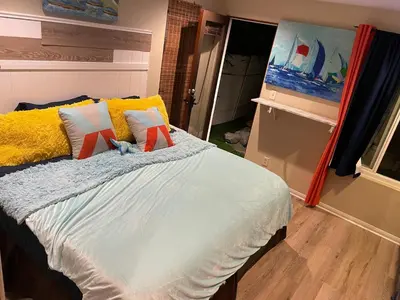 a bedroom with a bed with pillows and a painting at El Segundo Beach 5B4b Home, POOL Hot Tub, BEACHES, Local Town! in El Segundo