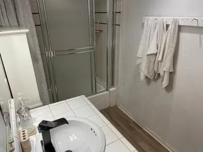 a white bathroom with a shower and a sink at El Segundo Beach 5B4b Home, POOL Hot Tub, BEACHES, Local Town! in El Segundo