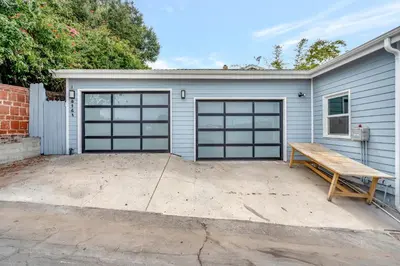 a garage with a bench in front of it at NEW BEACH Pool Home, New Industrial OCEAN Vibe, Hot Tub, Pool, Views in El Segundo