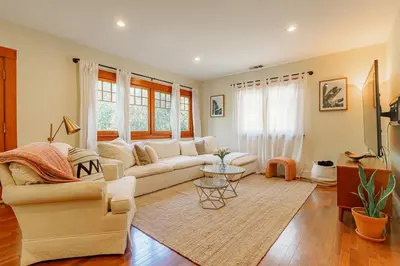 a living room with a couch and a table at Cozy 3 Bedroom Hollywood Home- Quick Walk To All Tourist Spots! in Los Angeles