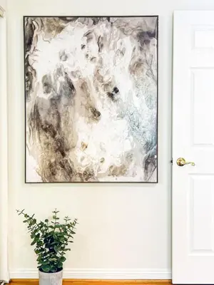 a painting on a wall next to a door with a potted plant at Diamond in Los Angeles- AM3 in Los Angeles