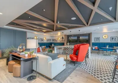 a living room with a couch and a table at Cosmopolitan Hollywood Home DTLA view Parking - 10mins to Universal Studios in Los Angeles