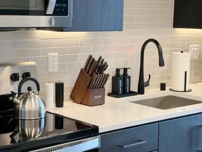 a kitchen counter top with a sink and a counter top at Cosmopolitan Hollywood Home DTLA view Parking - 10mins to Universal Studios in Los Angeles