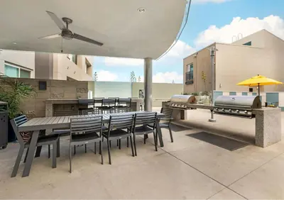 a patio with a table and chairs and a grill at Cozy Home in LA - Free Parking 10 Min to Cedars in Los Angeles