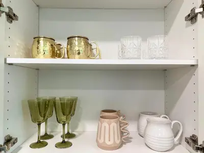 a shelf with wine glasses and other items on it at Luxurious Hollywood Home City View - Free Parking 10mins to Universal Studios in Los Angeles