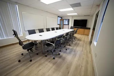 a conference room with a long table and chairs at Quiet King bed Westward Room in heart of Pasadena in Pasadena