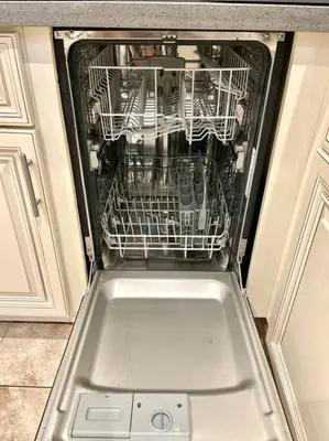 a dishwasher with its door open in a kitchen at FuLLy LoAdeD ReSerVaTioN 3bed 2ba w Parking in Los Angeles