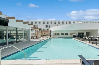 a large swimming pool with a building in the background at Monthier Downtown SA5S1U0 in Los Angeles