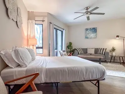 a bedroom with a bed and a living room at Monthier LACMA WI4S4U0 in Los Angeles