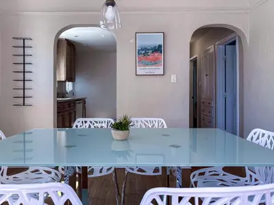 a dining room with a blue table and white chairs at Monthier Picfair Village CA1H6O23 in Los Angeles