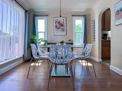 a dining room with a glass table and chairs at Monthier Picfair Village CA1H6O23 in Los Angeles