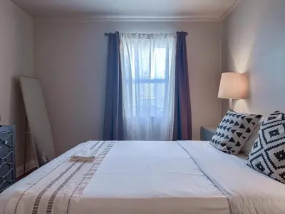 a bedroom with a large bed with a window at Monthier Picfair Village CA1H6O23 in Los Angeles