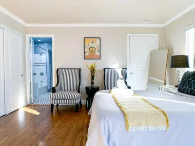 a bedroom with a bed and a chair at Monthier Picfair Village CA1G6R23 in Los Angeles