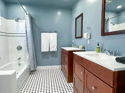 a blue bathroom with a sink and a tub at Monthier Picfair Village CA1G6R23 in Los Angeles