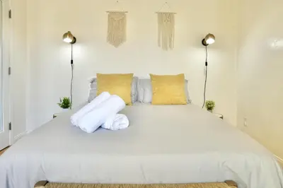 a bedroom with a white bed with two pillows at Monthier The Grove OA7T4H55 in Los Angeles