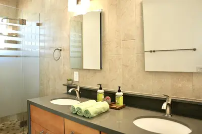 a bathroom with two sinks and a mirror at Monthier The Grove OA7T4H55 in Los Angeles