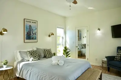 a bedroom with a bed with two towels on it at Monthier The Grove OA7T4H55 in Los Angeles