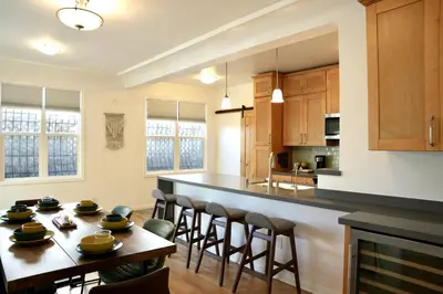 a kitchen with a table and chairs and a counter at Monthier The Grove OA7T4H55 in Los Angeles