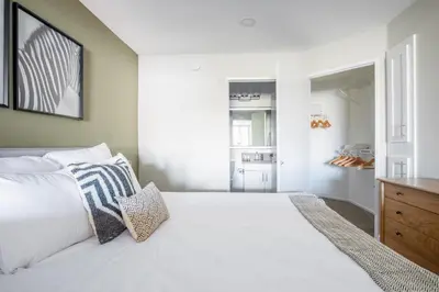 a bedroom with a large white bed with pillows at Brentwood Studio w Pool nr UCLA Whole Foods LAX-290 in Los Angeles
