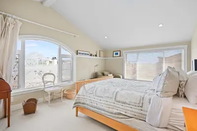 a bedroom with a bed and a large window at Sand Side Bliss in Oxnard