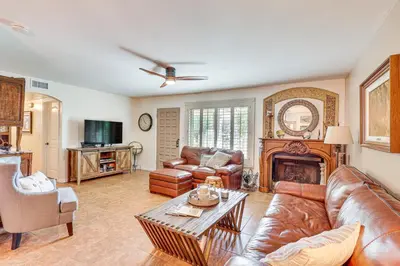 a living room with leather furniture and a fireplace at Redlands Home with Community Perks 1 Mi to Downtown in Redlands