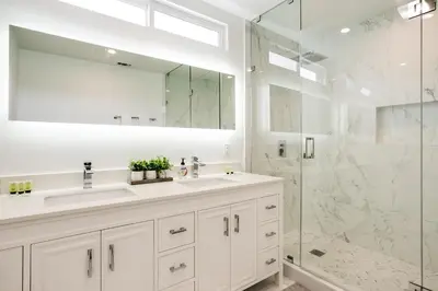 a white bathroom with a sink and a shower at Monthier Melrose PO7H2O0 in Los Angeles