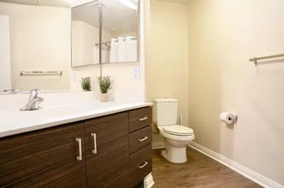 a bathroom with a sink and a toilet and a mirror at Los Angeles Modern Studio in Los Angeles