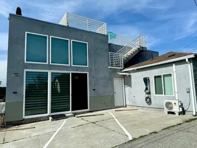 a house with a balcony on top of it at Brand-New Dtla building with rooftop patio in Alhambra