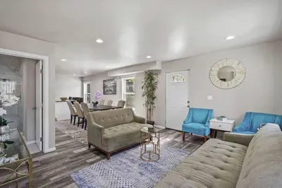 a living room with a couch and a dining room at Spacious family Guesthouse private entry near six flags in Santa Clarita