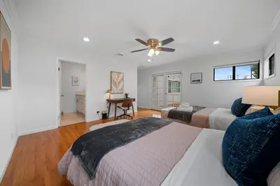 a bedroom with two beds and a ceiling fan at # Marbella Lane - Serene and Pristine 2BR Home in West Covina