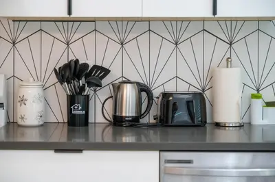 a kitchen counter with appliances on a counter top at # Marbella Lane - Serene and Pristine 2BR Home in West Covina