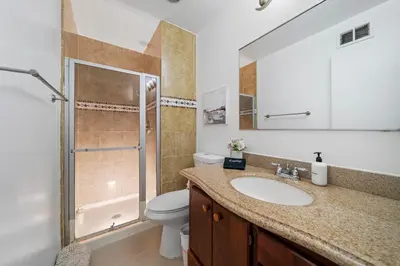 a bathroom with a sink and a toilet and a shower at # Marbella Lane - Serene and Pristine 2BR Home in West Covina