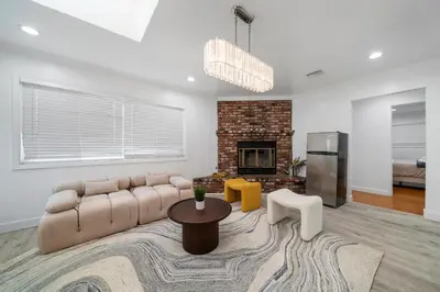 a living room with a couch and a fireplace at # Marbella Lane - Serene and Pristine 2BR Home in West Covina