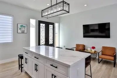 a kitchen with a white island in a room at H&H New Built 2023 Hidden Gem Heart of OC 3 Queen Beds in Westminster