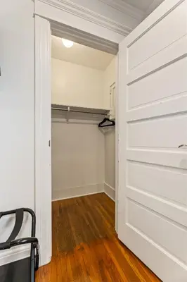 a closet with a white door and a chair at Los Angeles charming big house, king bed, parking, EV in Los Angeles