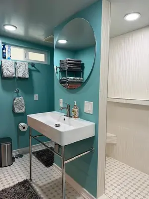 a bathroom with a white sink and a mirror at Pasadena Old Town village in Pasadena