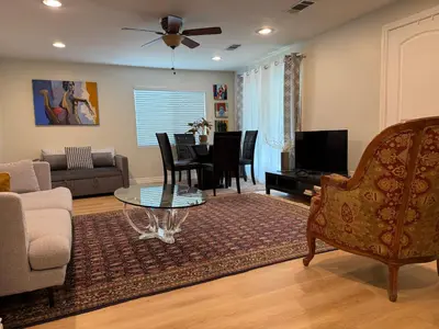 a living room with a couch and a table at Pasadena Old Town village in Pasadena