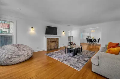 a living room with a couch and a table at Chic Charming 2-Bedroom with office in the WeHo in Los Angeles