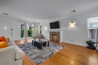 a living room with a couch and a fireplace at Chic Charming 2-Bedroom with office in the WeHo in Los Angeles