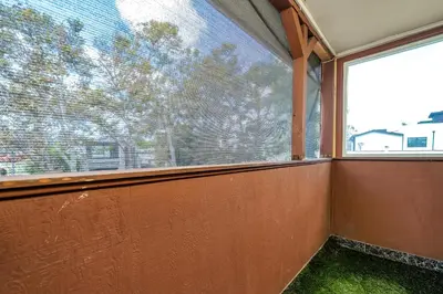 an empty room with a large window and green grass at Chic Charming 2-Bedroom with office in the WeHo in Los Angeles