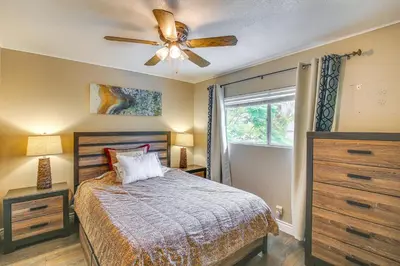 a bedroom with a bed and a ceiling fan at Anaheim Home with Pool, 14 Mi to Disneyland! in Anaheim