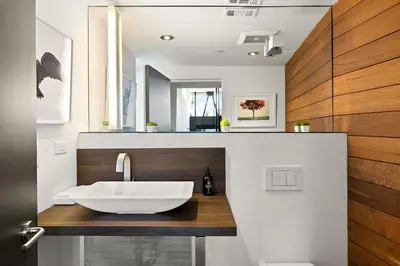 a bathroom with a sink on a wooden counter at Venice Rooftop 5bd 4 bt steps from the beach in Los Angeles