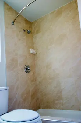 a bathroom with a shower with a toilet at Red Carpet Motel By Ontario in Ontario