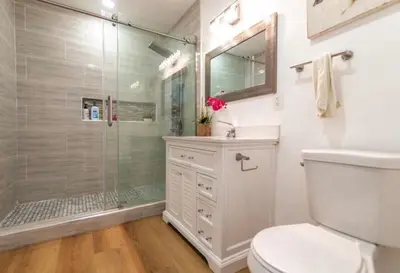 a bathroom with a shower and a toilet and a sink at Cozy Haven private room 3 in Los Angeles
